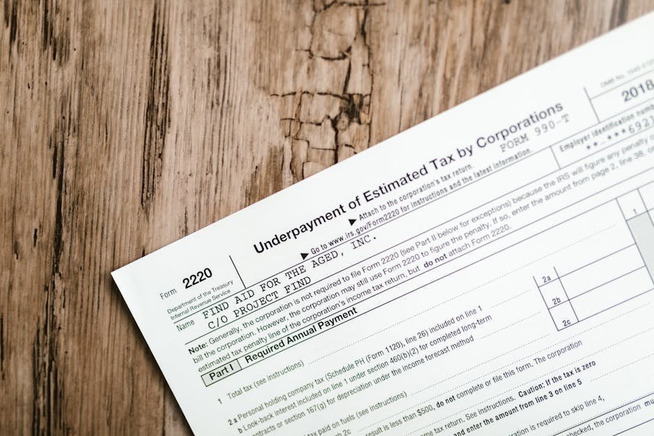 Tax forms and disability documentation laid out on a desk
