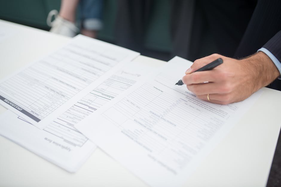 Therapist office with insurance verification document and patient reviewing benefits summary