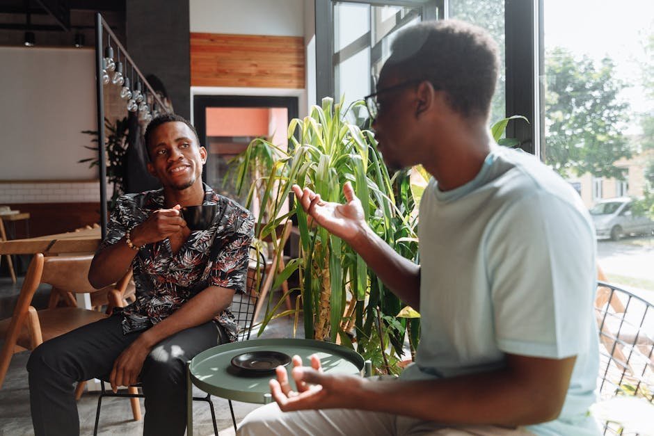 Two friends having a meaningful conversation over coffee, illustrating healthy emotional support