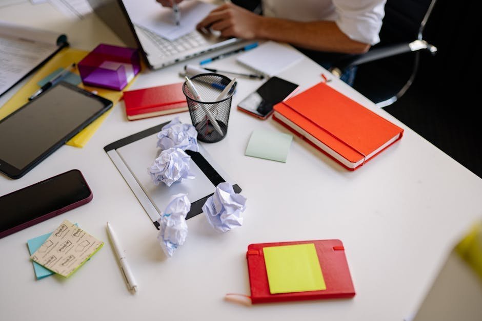 Adult man at cluttered desk with sticky notes and laptop searching for ADHD specialist online