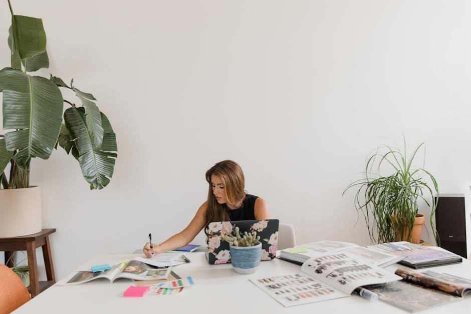 Freelance designer in Austin home office reviewing ACA marketplace plans on laptop